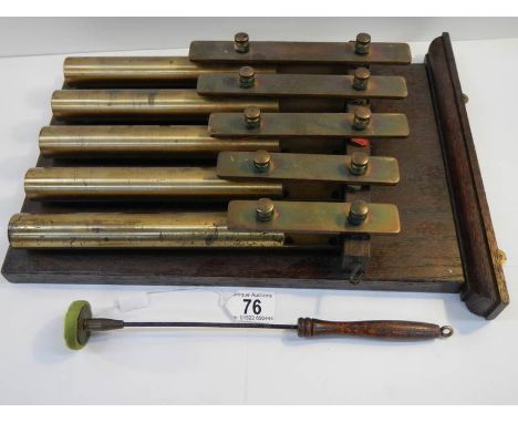 An unusual brass 5 key xylophone with brass bell tubes, complete with hammer and in good working order.