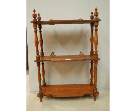 A 3 shelf oak book rack with original turnings and finials, 29" tall.