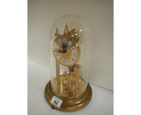 An early 20th century anniversary clock under dome, in working order.