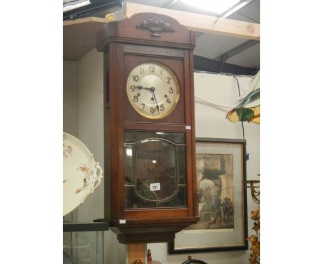 An oak wall clock