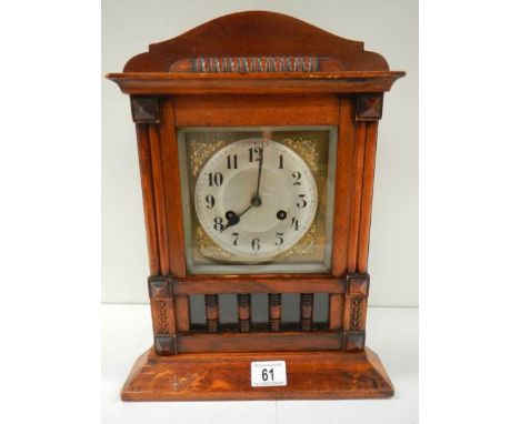 An early 20th century mantel clock in working order (spring ok and complete).