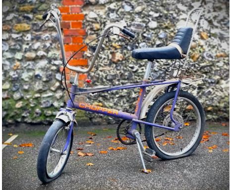 A vintage Raleigh Chopper bike,&nbsp;MKII in ultraviolet, (a good restoration project).&nbsp; 