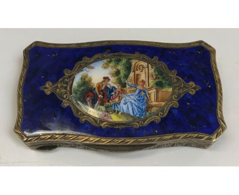 An 19th Century silver gilt and enamel decorated snuff box in the Louis XV style, the top decorated with figures in a landsca