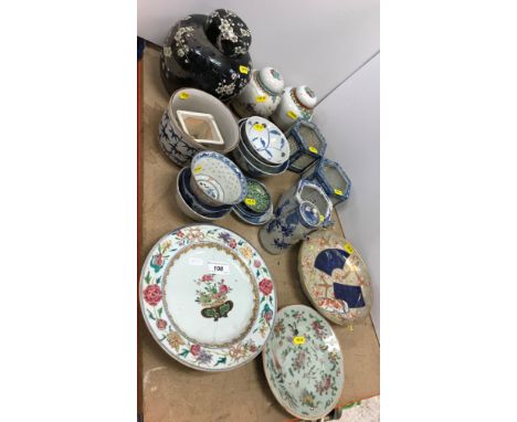 Two late 18th / early 19th Century Chinese famille rose plates with relief scrollwork centrefield decorated with vase of blos