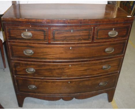 A 19th Century mahogany bow fronted chest, the cross-banded and ebony strung top over three short and three long graduated dr