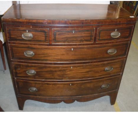 A 19th Century mahogany bow fronted chest, the cross-banded and ebony strung top over three short and three long graduated dr