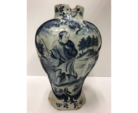 A 19th Century Dutch Delft baluster shaped vase with decoration of a Chinese figure with dog in a landscape, bearing stylised