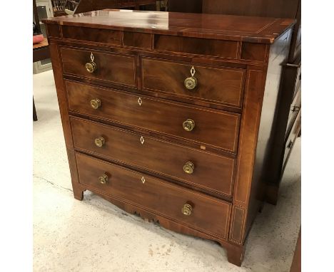 A 19th Century mahogany and inlaid square fronted chest of two short over three long graduated drawers with pressed brass kno