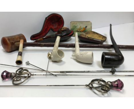 A vintage Meerschaum pipe, housed in a leather case depicting stylised claw, two silver and amethyst glass thistle shaped hat