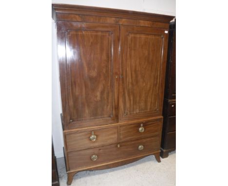 A 19th Century mahogany and satinwood strung linen press, the upper section with moulded cornice over two panelled doors encl