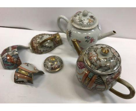 An 18th Century Chinese polychrome decorated bullet shaped teapot and cover, the main body decorated with figures in an inter