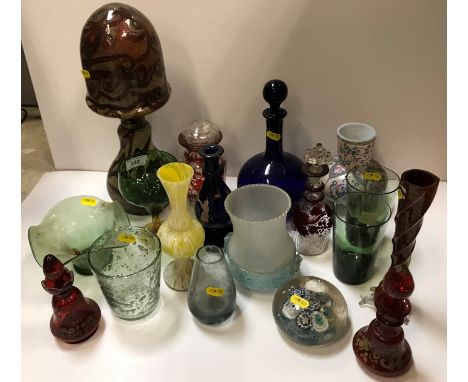 A collection of various mainly Continental coloured glasware including paperweight, two ruby glass bottles and covers, two ru