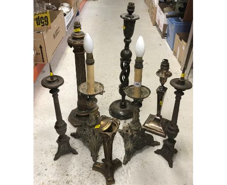 A collection of eight various table lights including two faux candlestands on dragon decorated tri-form gilt metal bases, 42.