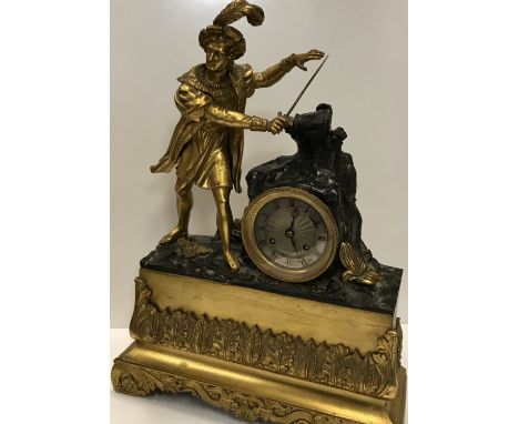A 19th Century gilt brass cased figural mantel clock, the eight day movement with silvered dial and Roman numerals stamped ve