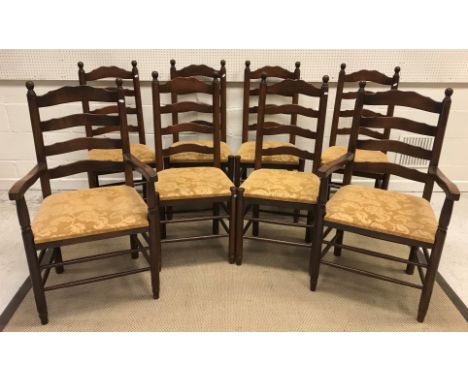 A set of eight late 20th Century oak ladder back dining chairs in the North Country style, on turned legs united by stretcher