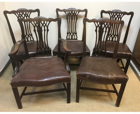 A set of five 19th Century mahogany Chippendale style dining chairs with moulded backs over shaped upholstered seats on mould