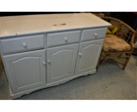 A painted pine dresser, the plain top above three drawers and three cupboard doors on bracket feet, 127 cm wide x 46 cm deep 