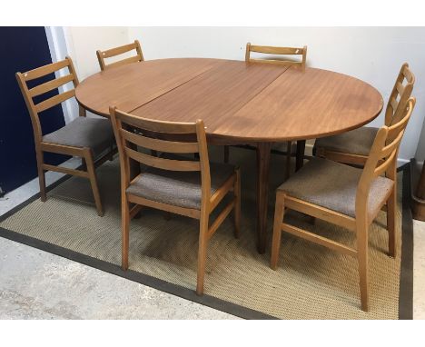 A Nathan teak D end dining table, 168 cm wide x 122 cm deep x 75.5 cm high, together with a set of six stained beech ladder b
