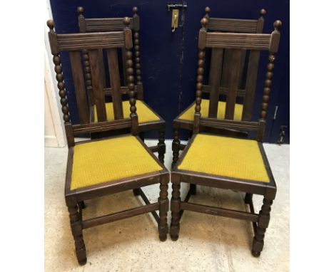 An Edwardian mahogany and satinwood banded Sheraton Revival elbow chair, a 1930's stained beech framed fireside chair, a set 