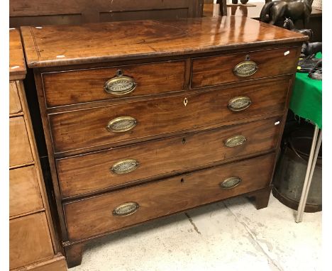A 19th Century mahogany chest, the cross-banded and inlaid top over two short and three long graduated drawers on bracket fee
