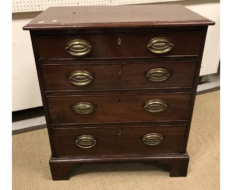 A late George III mahogany chest, the top with moulded edge above four long graduated drawers with replacement pressed brass 