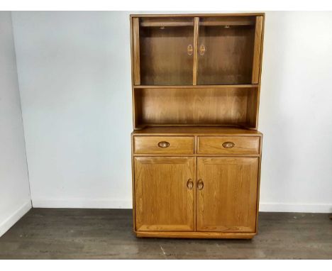 ERCOL, BLONDE ELM WINDSOR BOOKCASE / SIDE CABINET, the superstructure fitted with two glazed doors over a recess, the base wi