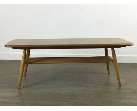 ERCOL, WINDSOR MODEL 459 ELM AND ASH COFFEE TABLE, on splayed supports joined by a spindled understageTop with scratches, nic
