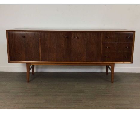 GIMSON & SLATER VESPER FURNITURE, TEAK SIDEBOARD, CIRCA 1960-69 with twin cupboard doors flanked by a fall front drinks cabin