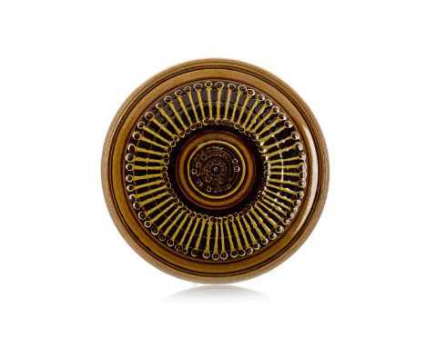 GUY SYDENHAM FOR POOLE POTTERY, CHARGER, CIRCA 1970-79 decorated in olive green and brown slip to speckled green ground, impr