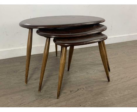 ERCOL, NEST OF THREE MODEL 354 STAINED 'PEBBLE' ELM TABLES, CIRCA 1960-69 the 'oyster' tops on splayed beech support, along w
