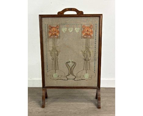 OAK FIRESCREEN, EARLY 20TH CENTURY inset with an Art Nouveau floral needlework panel50cm wide