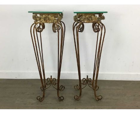 PAIR OF MID CENTURY WROUGHT IRON LAMP TABLES, with floral decoration and glass tops81cm high