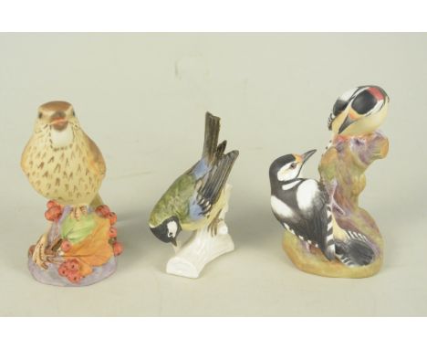 A Royal Worcester 'Pied Woodpeckers' figure group plus a Worcester thrush and a Goebel great tit