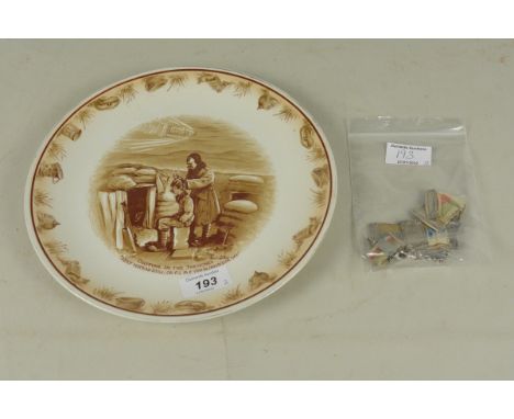 A Bairnsfather ceramic plate with three white metal mounted award ribbons (German 1930's)