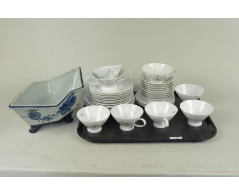 A part tea service by 'Rosenthal Germany' (thirty three pieces) plus a 20th Century Chinese blue glazed bowl on four squat fe
