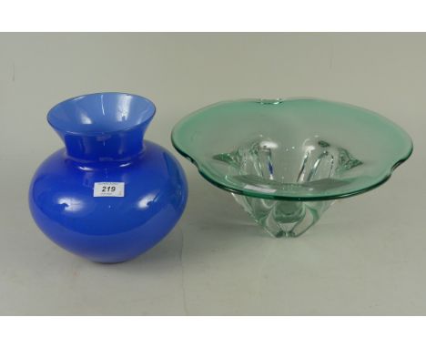 A large petal shaped light green glass bowl plus a blue bulbous shaped glass vase with wide neck