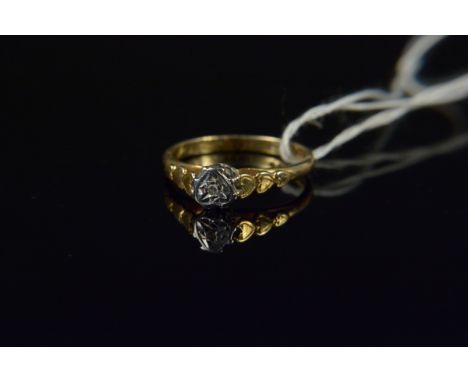 An 18ct gold diamond solitaire ring with heart shaped setting and heart decorated shoulders, size M 1/2, weight approx 2.7g