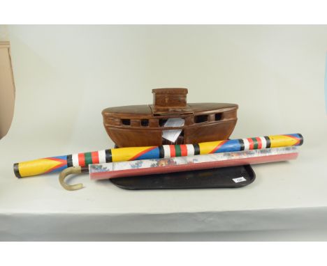 A vintage African hand carved wooden Noah's Ark with animals and Noah together with an Aboriginal rain stick, walking stick a