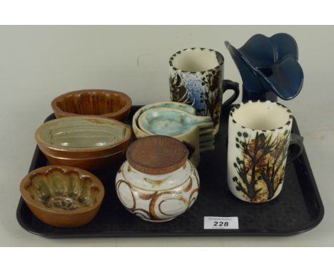 A mixed lot of UK and other Studio Pottery comprising of two mugs, a lidded pot and five small serving dishes on a stand, thr