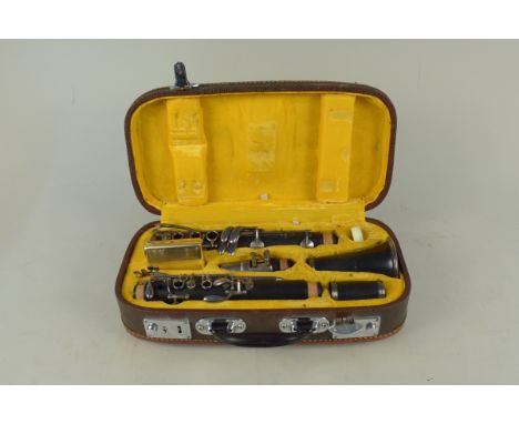 A cased vintage 'Lark' M4001 clarinet with black finish body (slight worn condition, case as found on one catch)