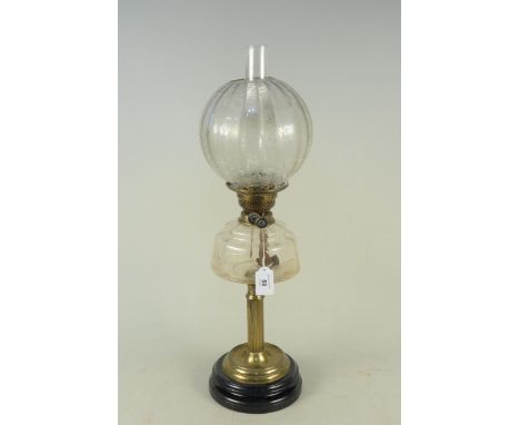 A Victorian oil lamp with brass column clear glass reserve and etched glass shade, 65cm tall