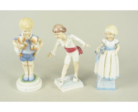 A Royal Worcester figurine 'Masquerade' 3359 by F G Doughty plus two Royal Worcester 'Mondays Child' figurines 3257 and 3519