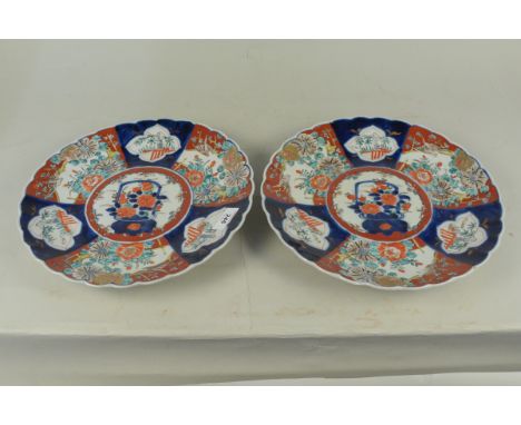 A pair of early 19th Century Chinese hand painted large plates, 31cm dia with light decoration to rear (minor rim chips)