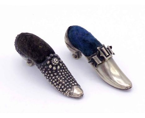 A late Victorian silver shoe pin cushion by Adie & Lovekin Ltd., Birmingham, 1891, with ribbon-tied buckle and blue velvet cu
