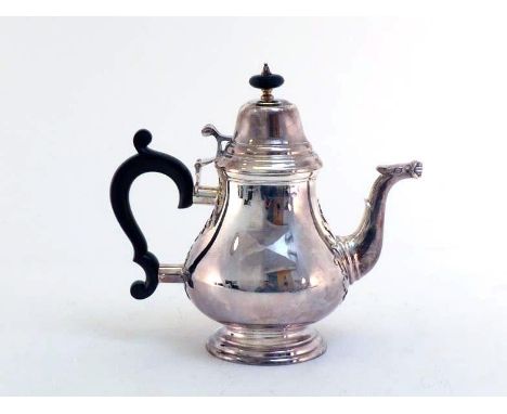 A good silver teapot of Queen Anne style by John Lodge Ltd., Sheffield, 1971, baluster form with domed cover and cut-card dec