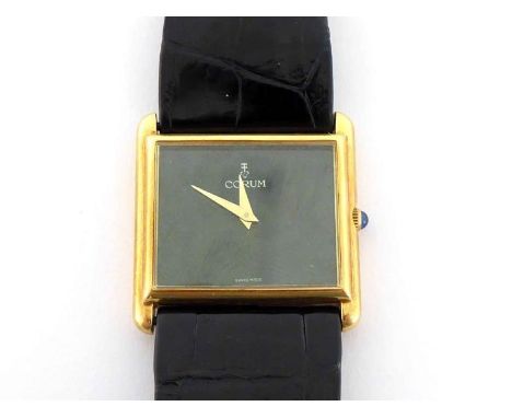 CORUM, an 18 carat gold manual wind wristwatch, no. 159758, the black dial with gilt sword hands, blue cabochon crown, with C