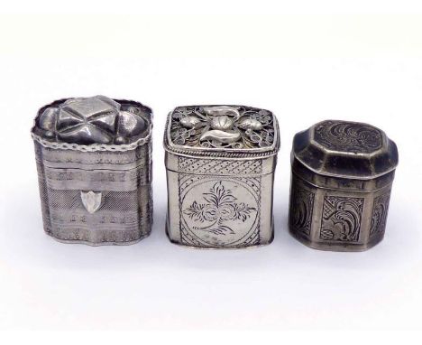 Three Dutch silver perfume boxes comprising:- one octagonal, engraved with scrollwork panels, 1853; one maker's mark "R" with