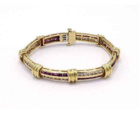 A ruby and diamond line bracelet, composed of two rows of alternating channel set round cut rubies and brilliants, diamonds t