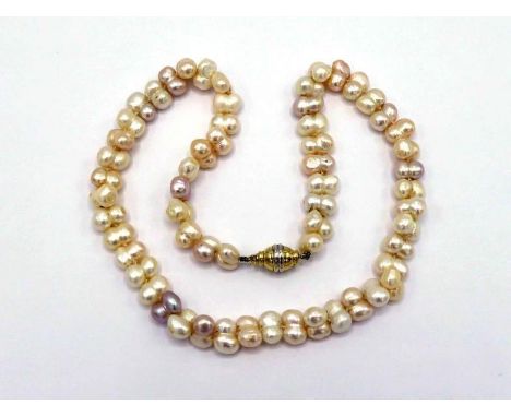 A freshwater cultured pearl necklace, composed of irregular waisted pearls, to a two colour barrel clasp stamped '585', 46cm 