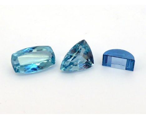Two loose cut blue topaz, the trillion cut 15 x 11.5 x 7mm, the rectangular cushion cut 18 x 11 x 7mm, together with a hemisp